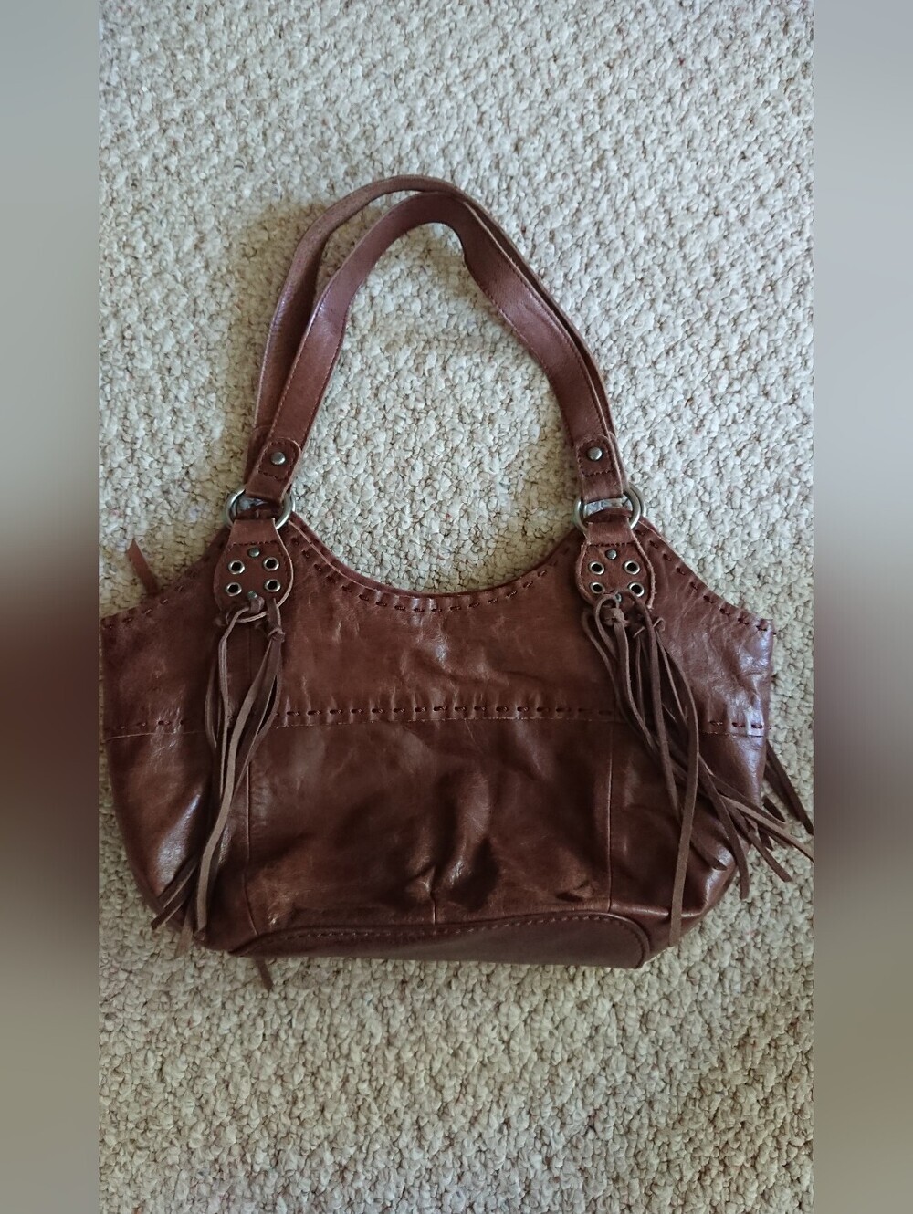 The Sak Indio large brown leather hobo shoulder bag with fringe tassels